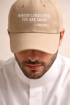 Nobody cares until you’re saudi beige cap